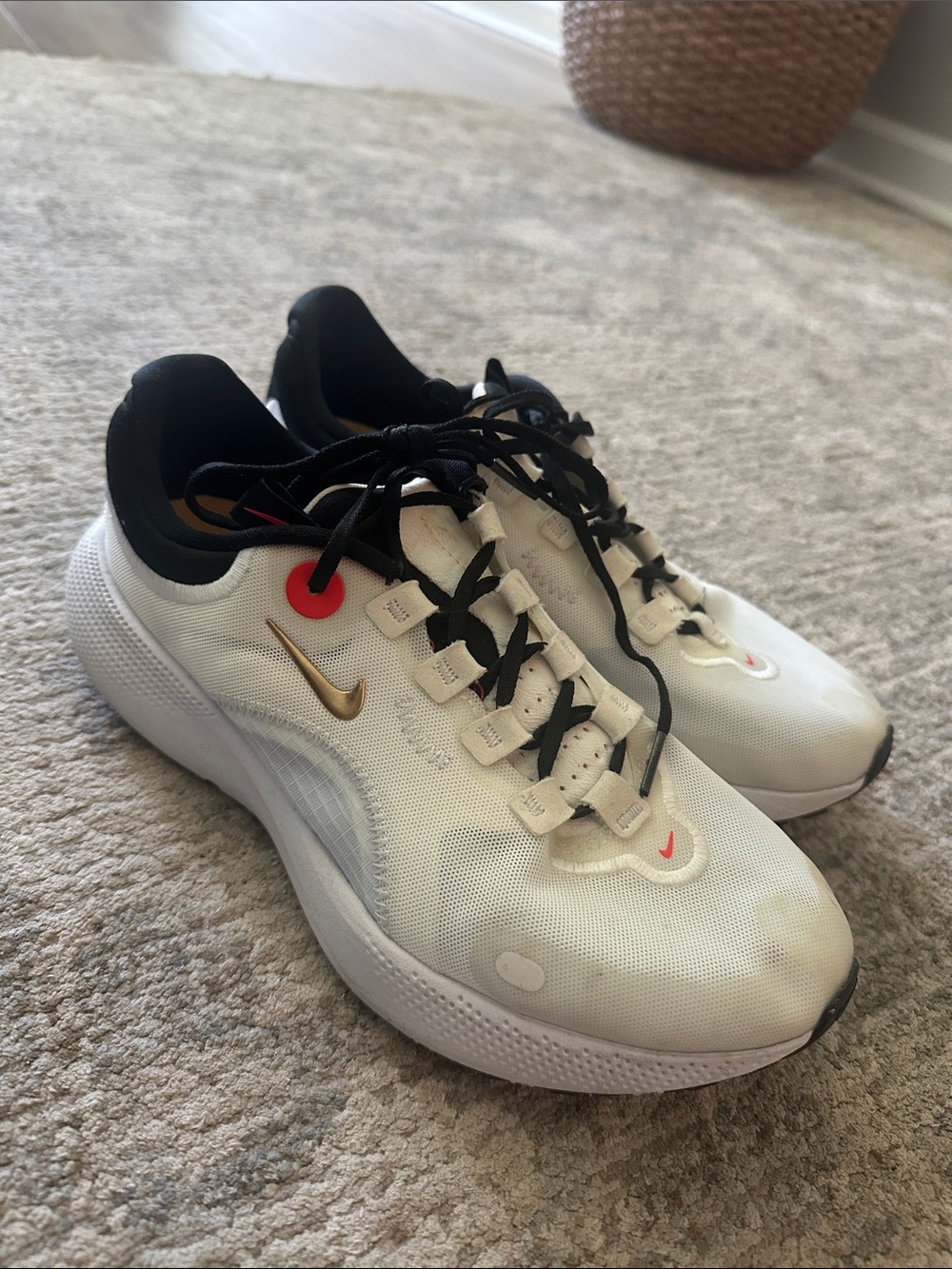 Nike White Sneakers with Gold Swoosh and Black Accents